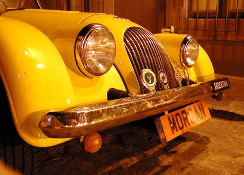front of yellow car