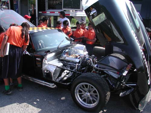 kids around black car