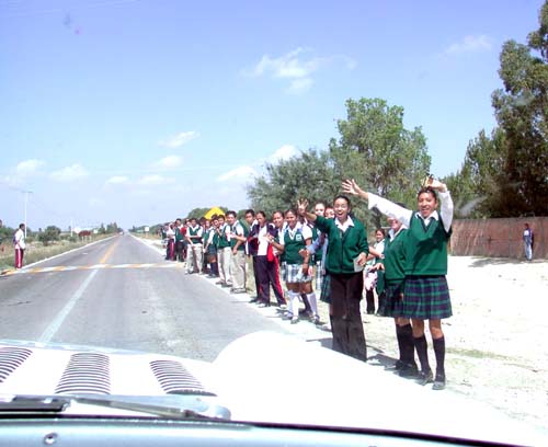 school kids on side of road