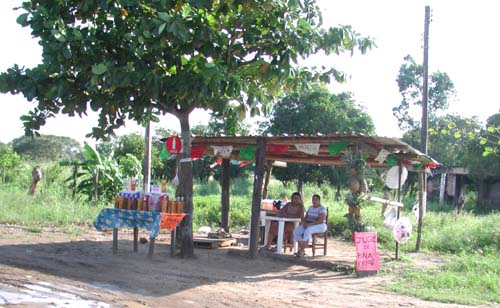 women vendors on side of 
road